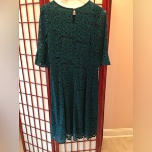 Dark green lace dress in size XL.